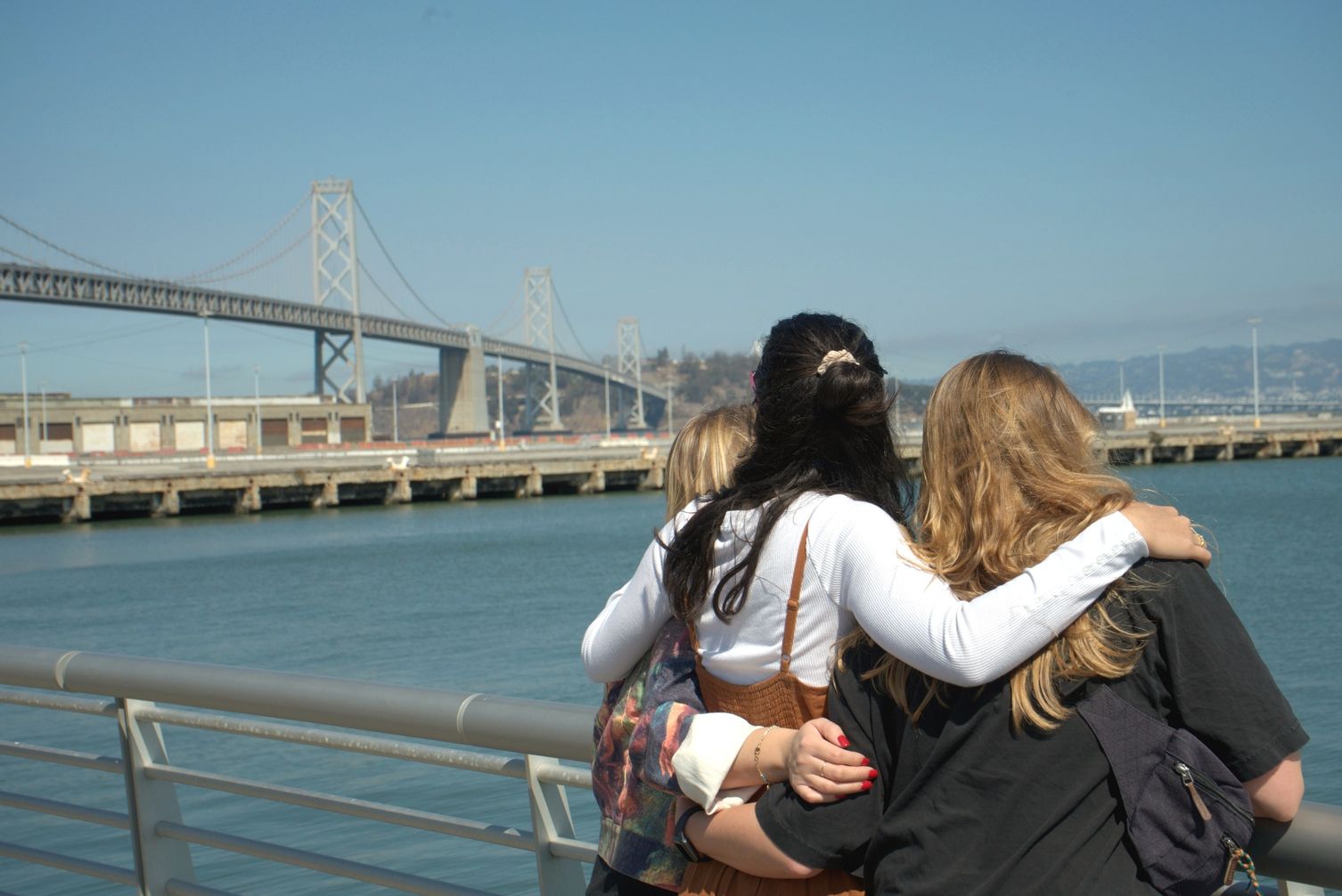 photo of Friends at San Francisco Embarcadero overlooking Bay Bridge