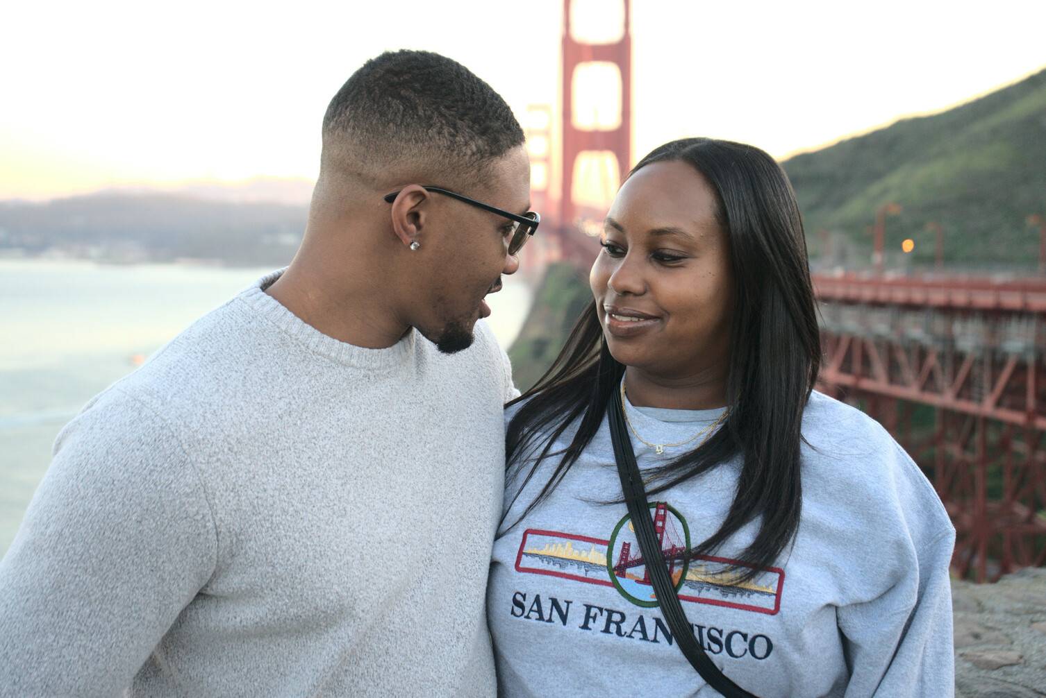 Beautiful Black couple shares tender moment at the Golden Gate Bridge Vista Point